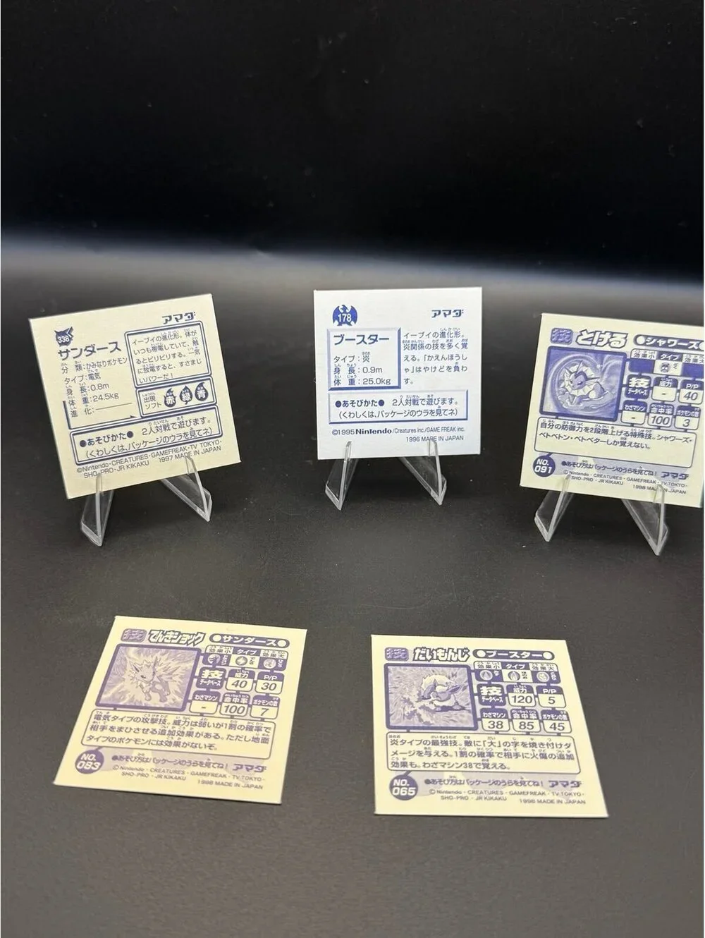 Vintage Japanese Pokémon Eeveelution sticker lot featuring Jolteon, Flareon, and